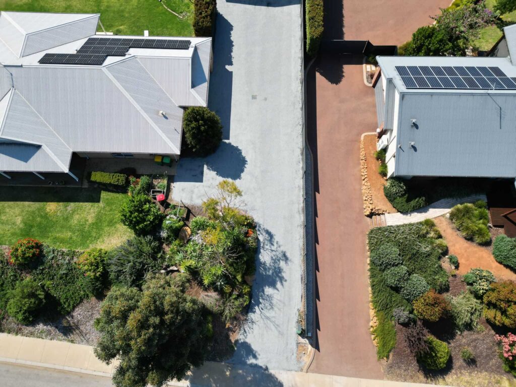 Aerial view of newly paved residential driveways.